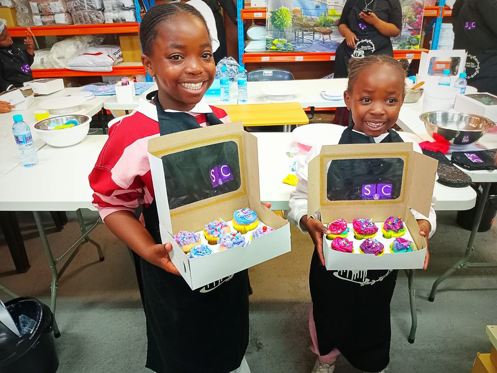 Two Young Bakers & Their Decorated Cupcakes — baked by Bobo's Cakes & Catering