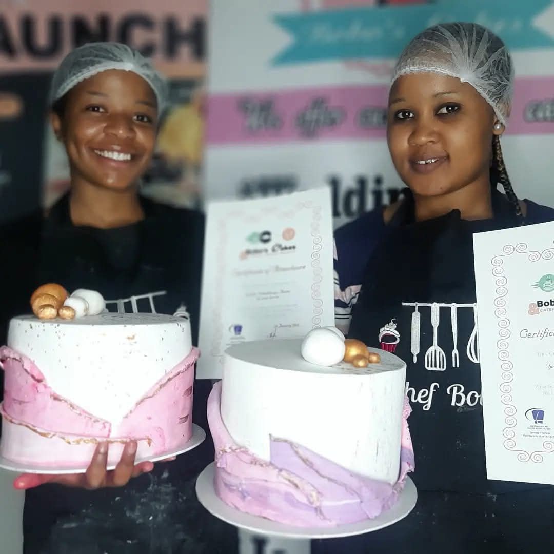 Two Students with Their Marble Cakes — baked by Bobo's Cakes & Catering