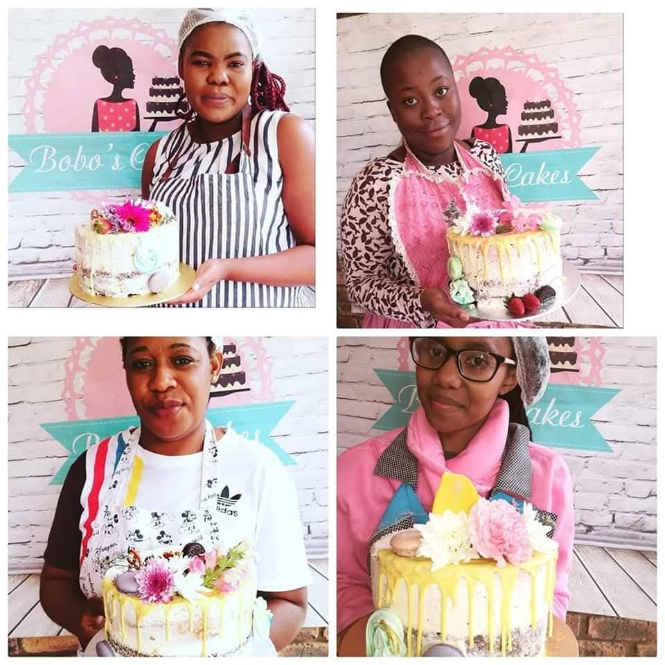 Four Graduates with Their Drip Cakes — baked by Bobo's Cakes & Catering